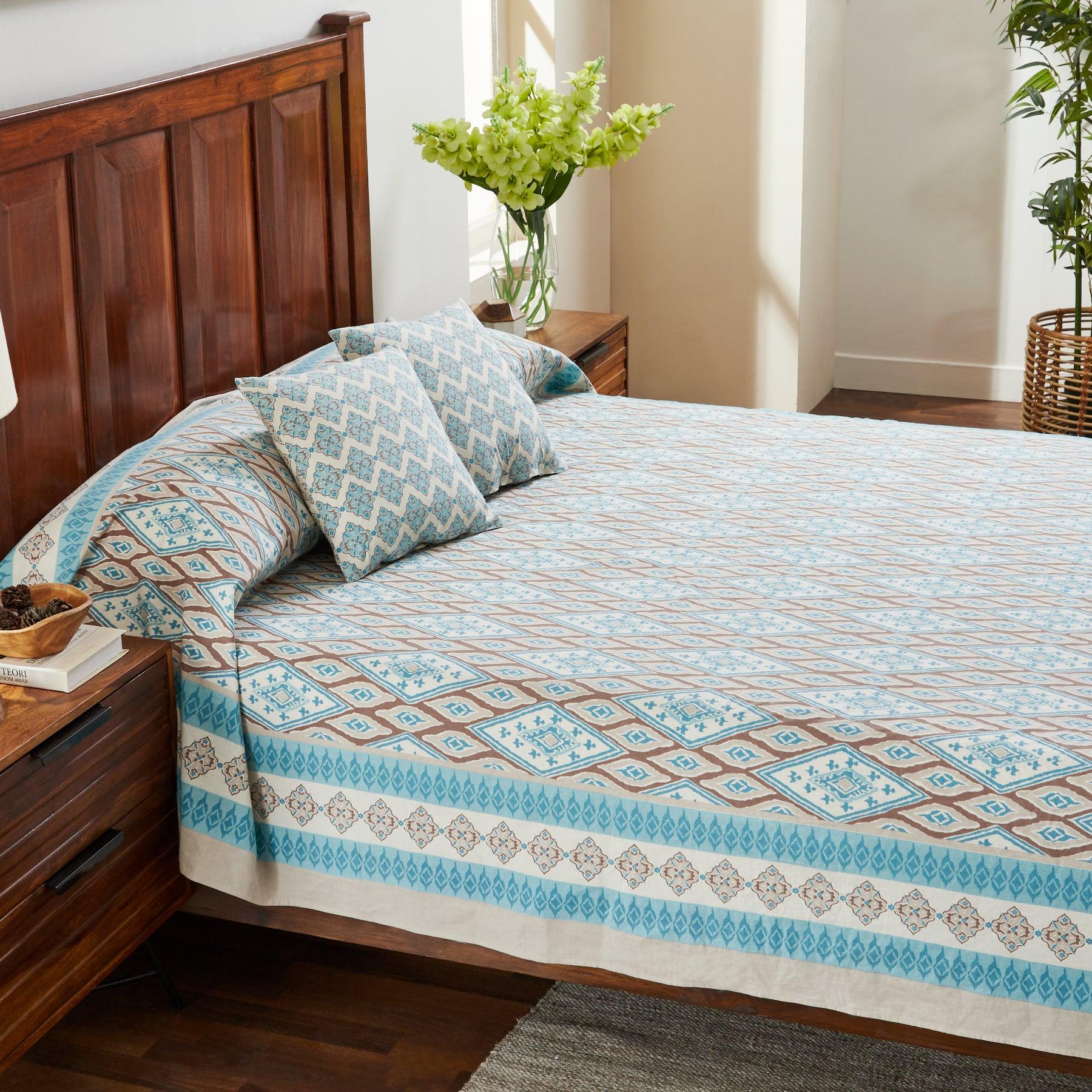 Uzbek Ikat Turquoise Brown Hand Block Printed Cotton Bedcover Ratan Texprocess Pvt. Ltd